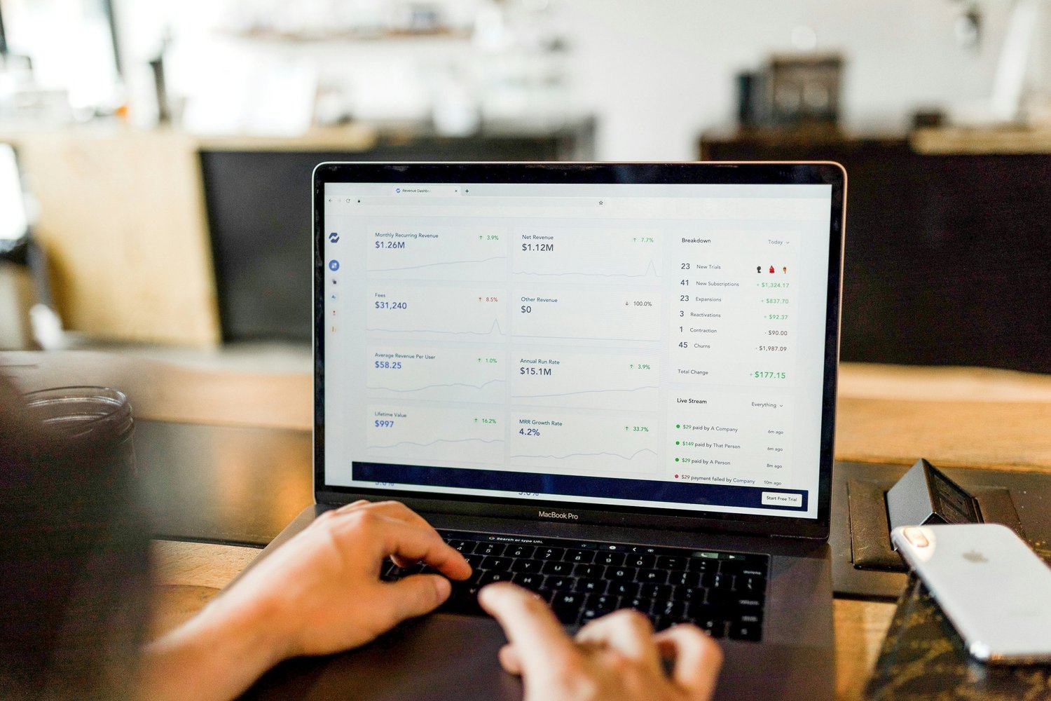 Business owner reviewing financial information on a laptop